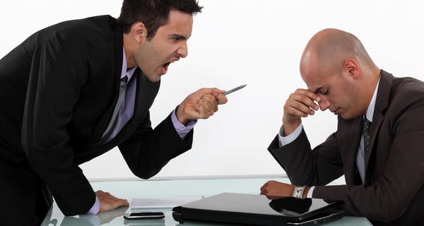 Businessman screaming at a colleague